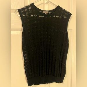 Sheer houndstooth print top, cinches at the bottom. Size small, gently used.